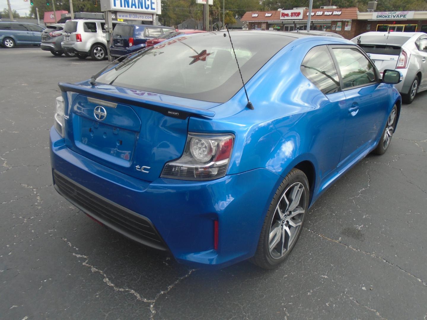 2014 Scion tC Sports Coupe 6-Spd AT (JTKJF5C75E3) with an 2.4L L4 DOHC 16V engine, 6-Speed Automatic transmission, located at 6112 N Florida Avenue, Tampa, FL, 33604, (888) 521-5131, 27.954929, -82.459534 - Photo#3